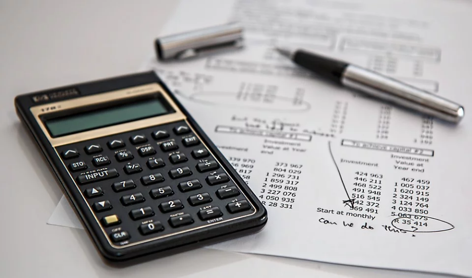 financial reports and a calculator